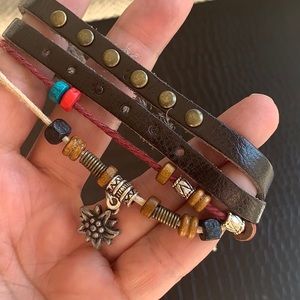 Leather bracelet with beads and charms. New